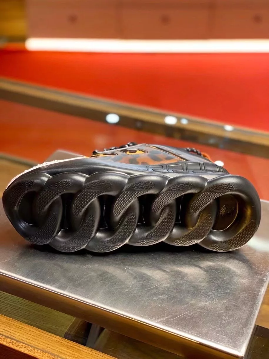 VERSACE WOMEN'S BLACK CHAIN REACTION SNEAKERS WITH LEOPARD PRINT - VSS027