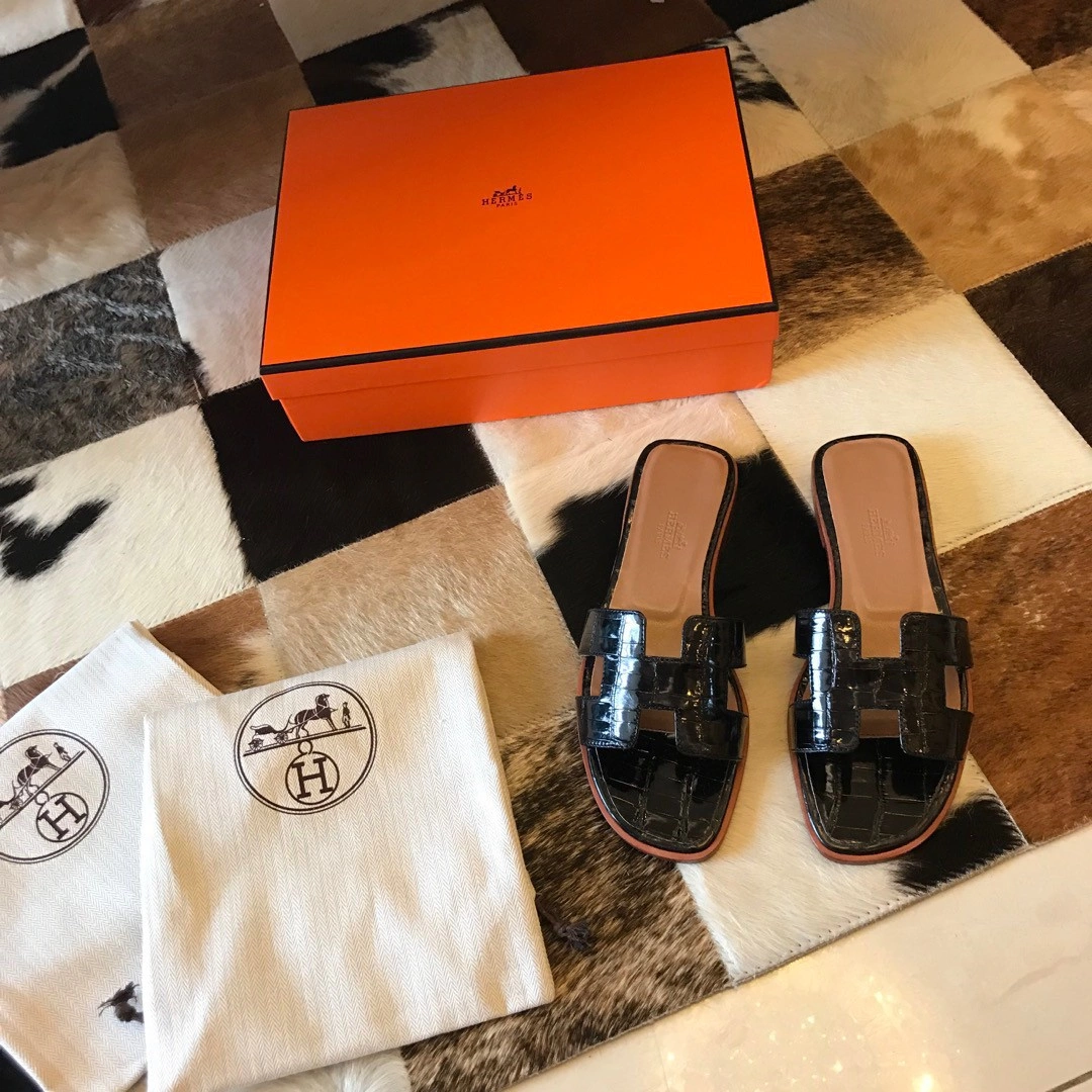 HERMES ORAN SLIDE SANDALS IN BLACK SHINY NILOTICUS CROCODILE SKIN - HMSD046